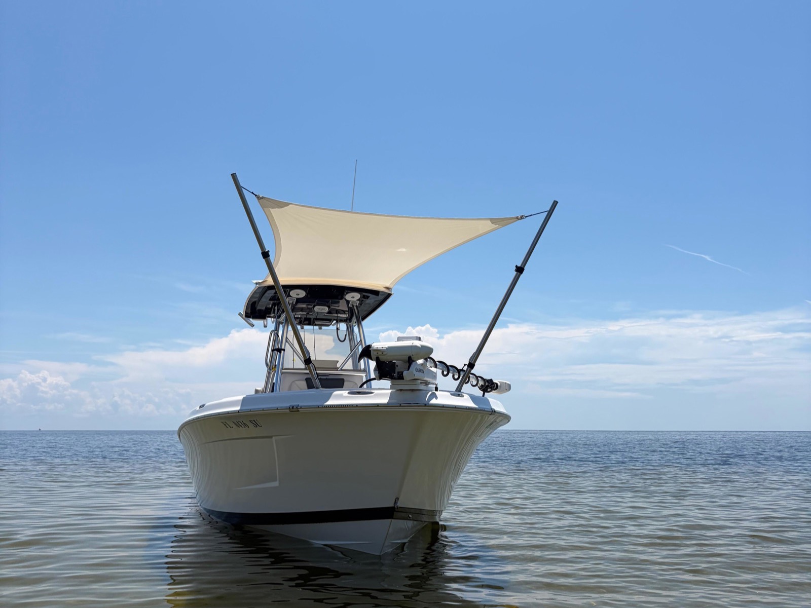 Custom bow sun shade on a Blue Wave 2800 Makaira center console on the water near St. Marks, Florida
