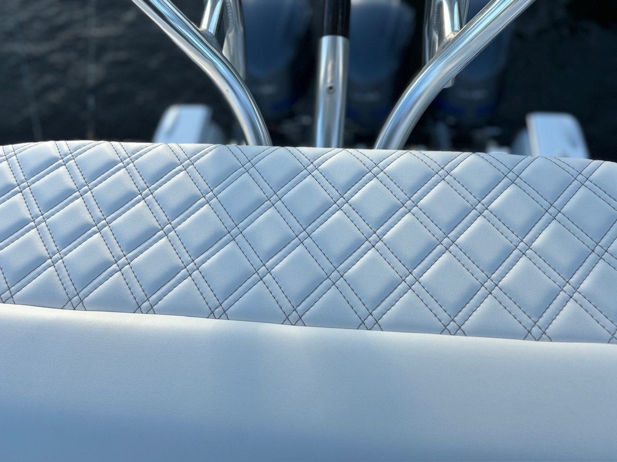 Southport center console seating rebuilt in diamond-stitch marine upholstery